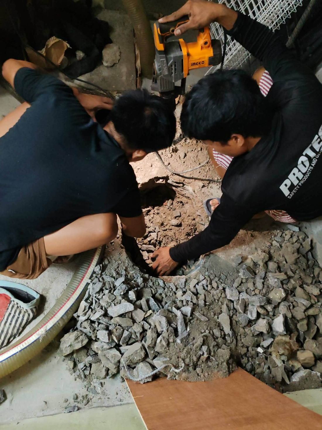 Team digging septic tank access